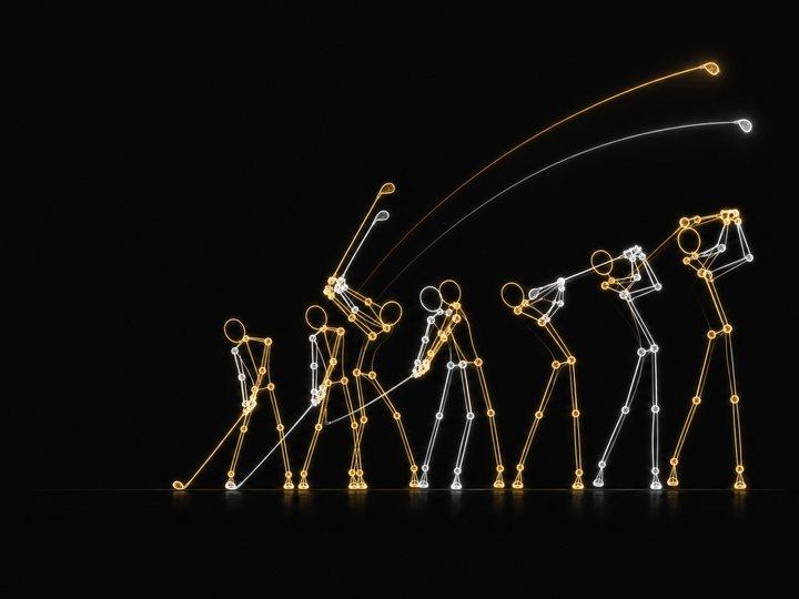 Two overlaid golf swing pose skeletons, one gold and one silver, tracing the same swing sequence from address to follow-through with glowing ball-flight arcs, on a black background